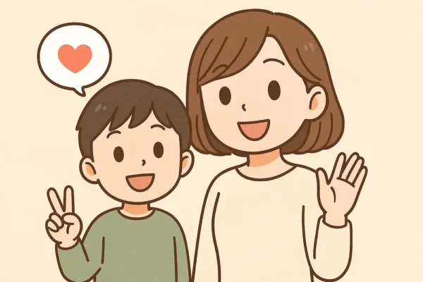 こっちを向いて“だいじょうぶだよ”と微笑むお母さんと子ども」