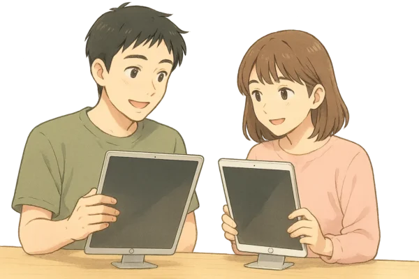 構図：2人が「進化してるね」と感心した様子で、12.9インチと10.5インチのiPad Pro（第2世代）を手に取って比較している  背景：木目調テーブルと、Appleストア風のシンプルで明るい展示棚