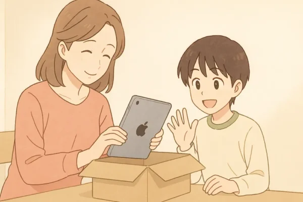 お母さんがiPadを箱に入れている
子どもが「ありがとう」と手を振っている
