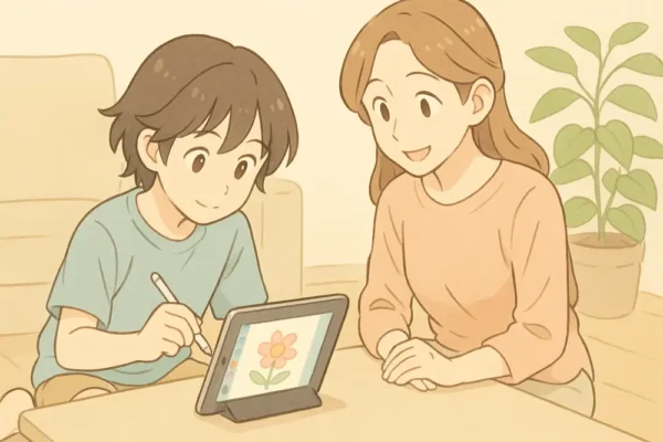 子どもがiPadでお絵かきを楽しんでいる
お母さんが横で見守っている
iPadの画面にカラフルなお絵かきアプリ