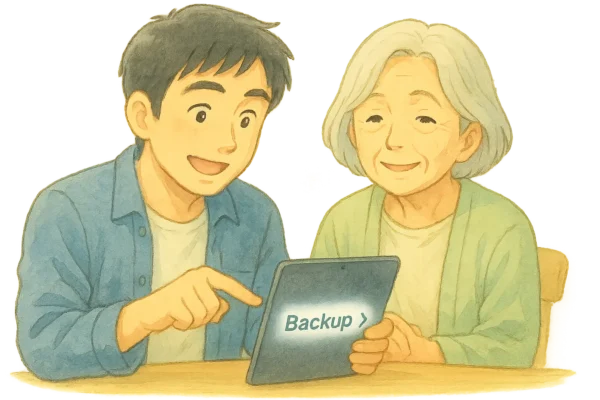 ひろとがiPadを操作して「バックアップ」を設定している場面。おばあちゃんは隣で安心して見ている。